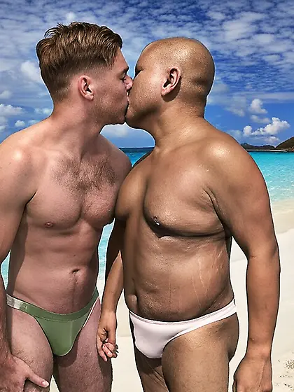 Kissing at the beach in our bikinis
