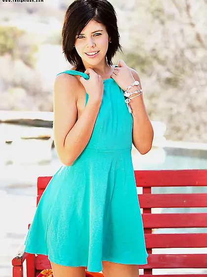 Brunette doll Britt Shields is showing white panty up skirt and