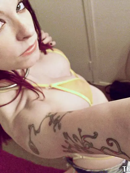 Busty redhead babe wiggles